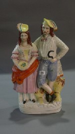 Appraisal: A Staffordshire figure of a farmer and wife cmh