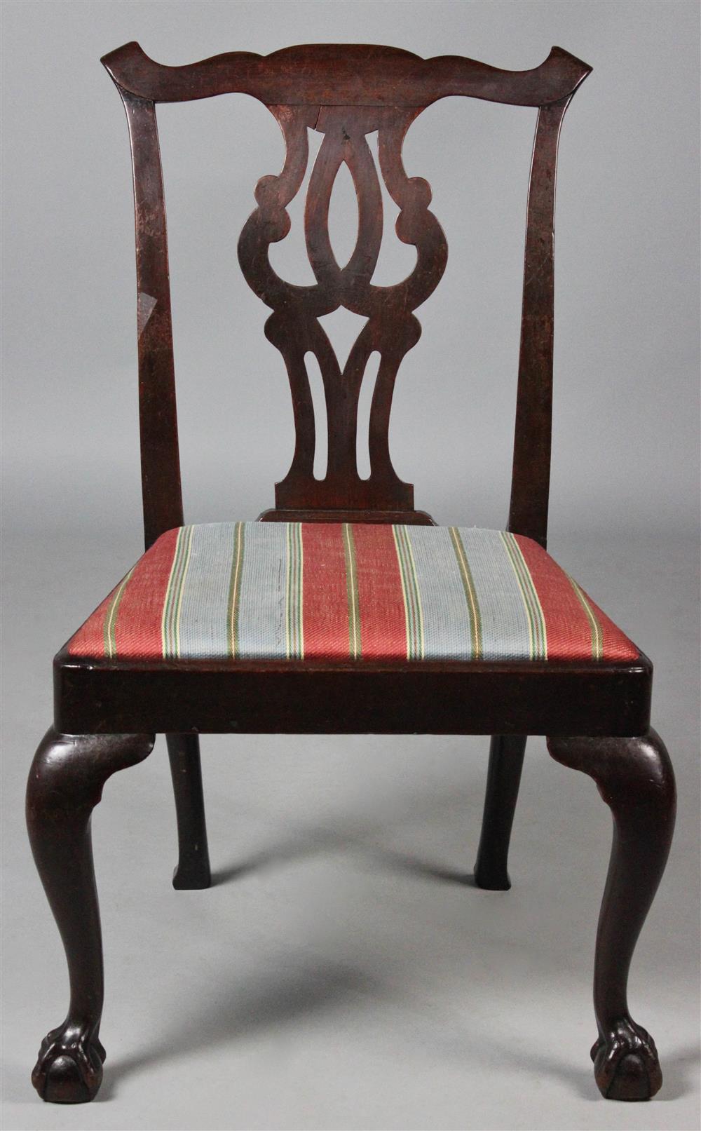 Appraisal: CHIPPENDALE CARVED MAHOGANY SIDE CHAIR the shaped crest rail with