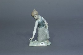 Appraisal: A Lladro figure of a girl picking roses cm