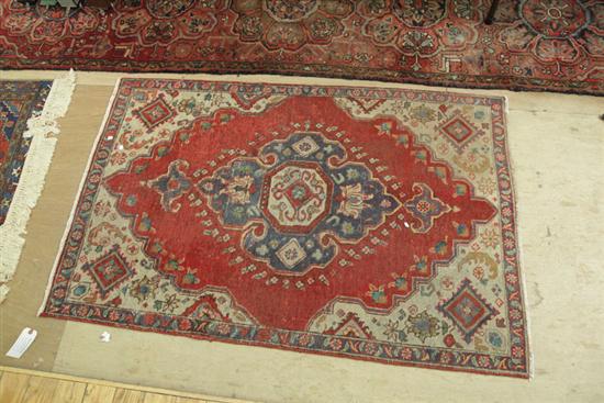 Appraisal: HAND KNOTTED RUG Persian th century with blue medallion and