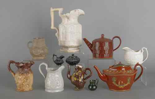 Appraisal: Miscellaneous group of porcelain and pottery pitchers and teapots tallest