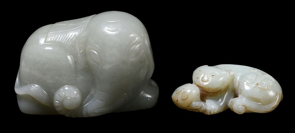 Appraisal: Two Carved Jade Animal Figures grayish celadon color resting elephant