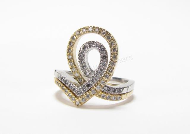 Appraisal: A K white and yellow gold puzzle ring set with