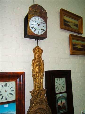 Appraisal: A French Comtoise wall clock the twin train movement with