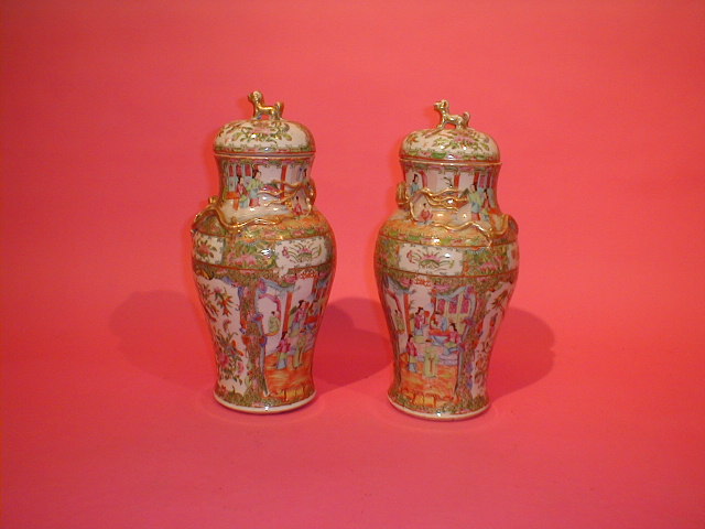 Appraisal: A pair of thC Cantonese baluster vases with covers decorated