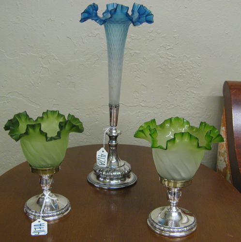 Appraisal: THREE DECORATIVE ART GLASS AND SILVER ITEMS a trumpet vase