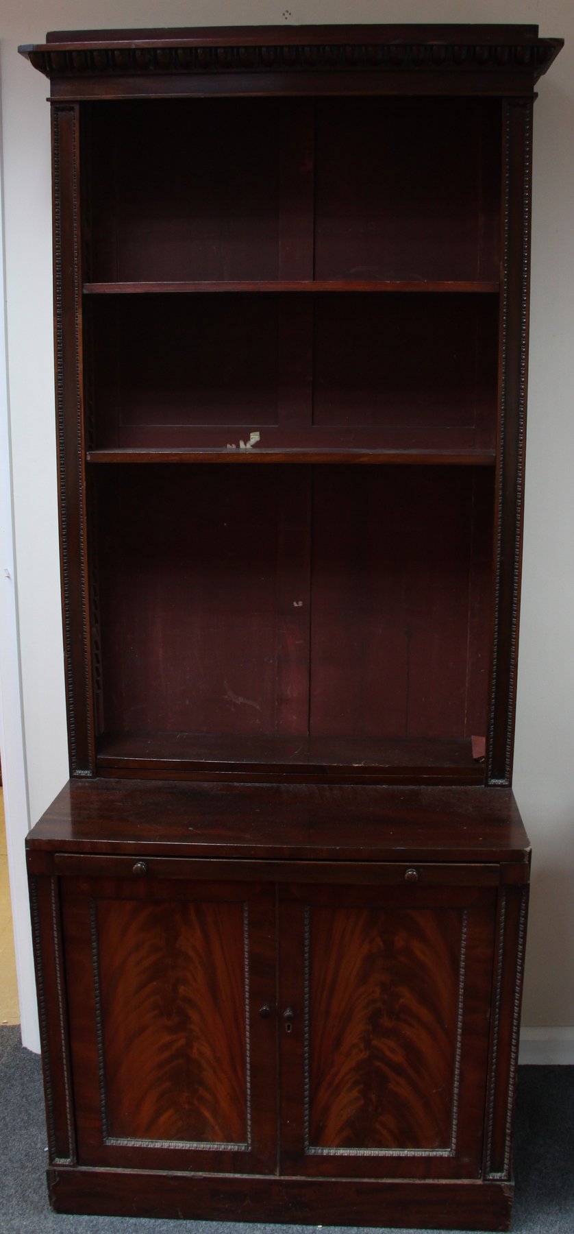 Appraisal: An early th Century mahogany bookcase the open shelves on