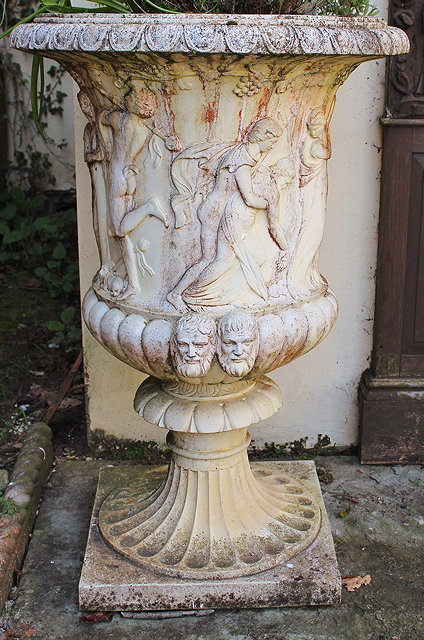 Appraisal: A PAIR OF CAST CLASSICAL URNS with egg and dart