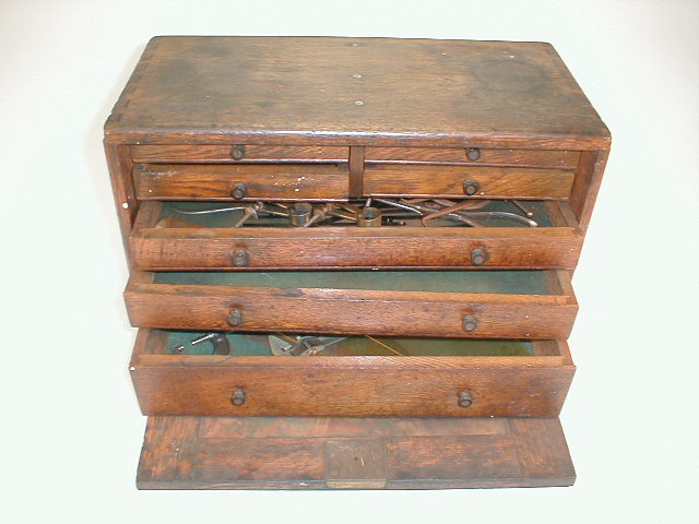 Appraisal: An oak table top tool chest with various dividers micrometer