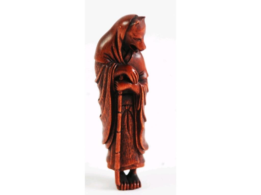 Appraisal: ORIENTAL SMALL CARVED WOOD FIGURE with wolf's head cm high