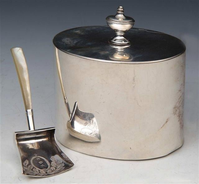 Appraisal: A GEORGE III SILVER PLAIN OVAL TEA CADDY with urn