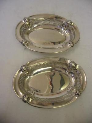 Appraisal: A PAIR OF BONBON DISHES of oval form with scroll