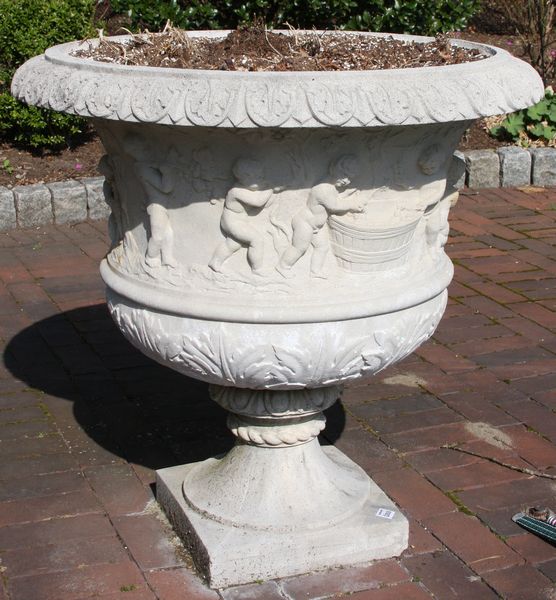 Appraisal: Classical cement garden urn having putti design EST