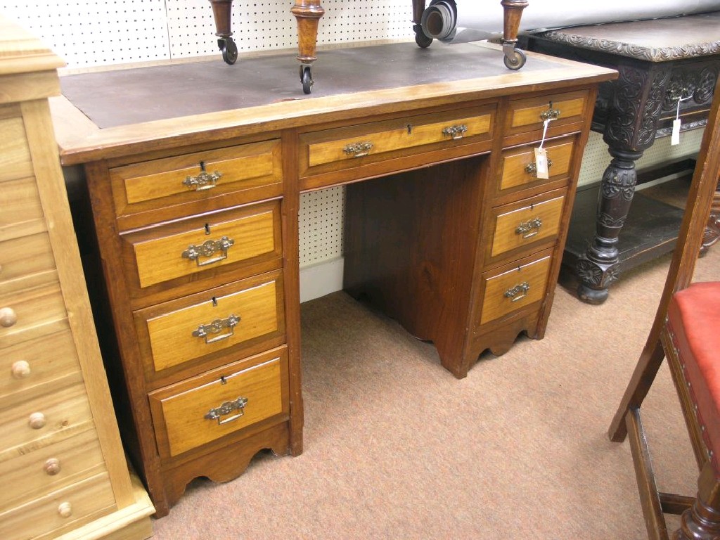 Appraisal: A late Victorian walnut pedestal desk with three frieze drawers