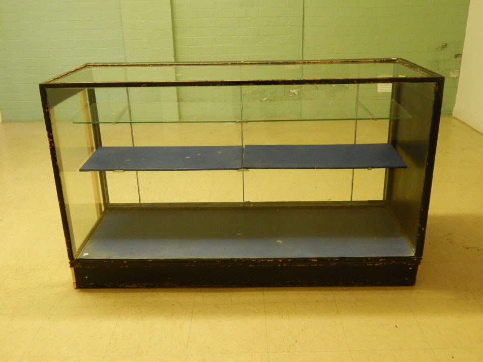 Appraisal: A thC ebonised and glazed shop counter with adjustable shelves