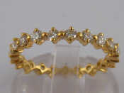 Appraisal: A yellow metal tests carat gold diamond eternity ring size