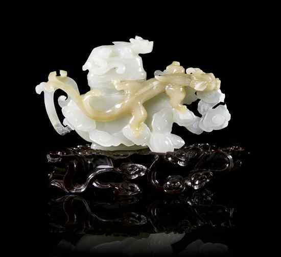 Appraisal: A White Jade Lidded Vessel comprising a compressed lidded vase