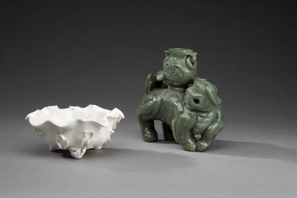 Appraisal: CHINESE DARK GREEN CARVED JADE FIGURE OF A FOO DOG