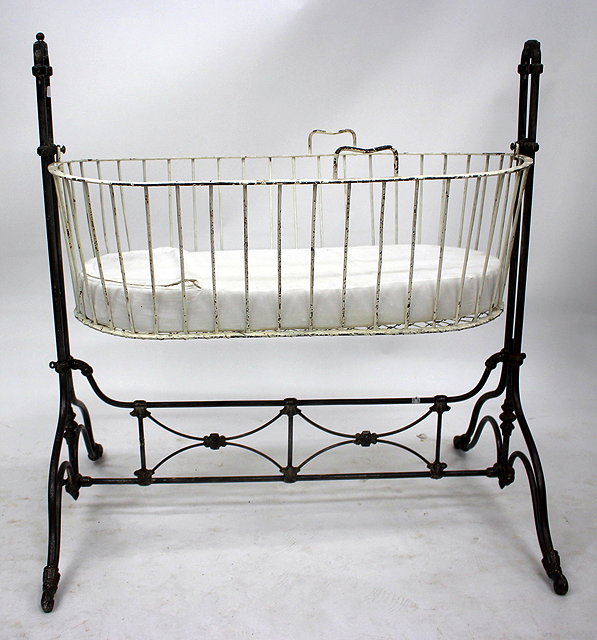 Appraisal: AN OLD CONTINENTAL WROUGHT IRON CHILD'S SWINGING COT on a