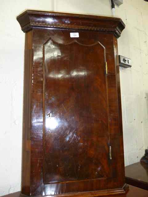 Appraisal: A SMALL MAHOGANY CORNER CUPBOARD with single door wide x