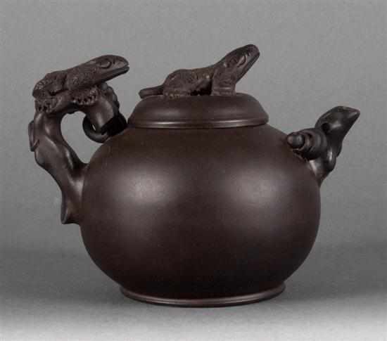 Appraisal: Chinese blackware teapot finial and handle with salamander decoration impressed