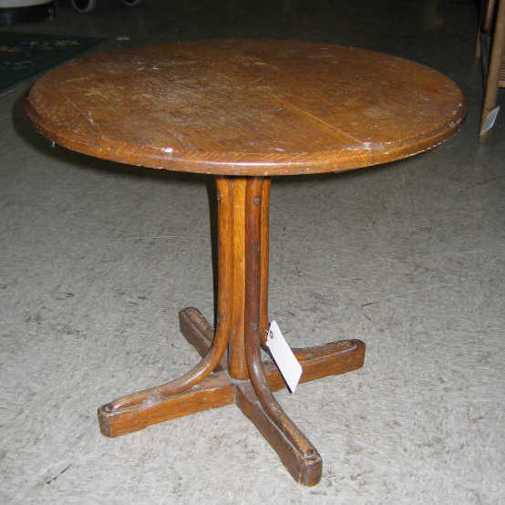 Appraisal: OAK BENTWOOD OCCASIONAL TABLE the circular top raised on center