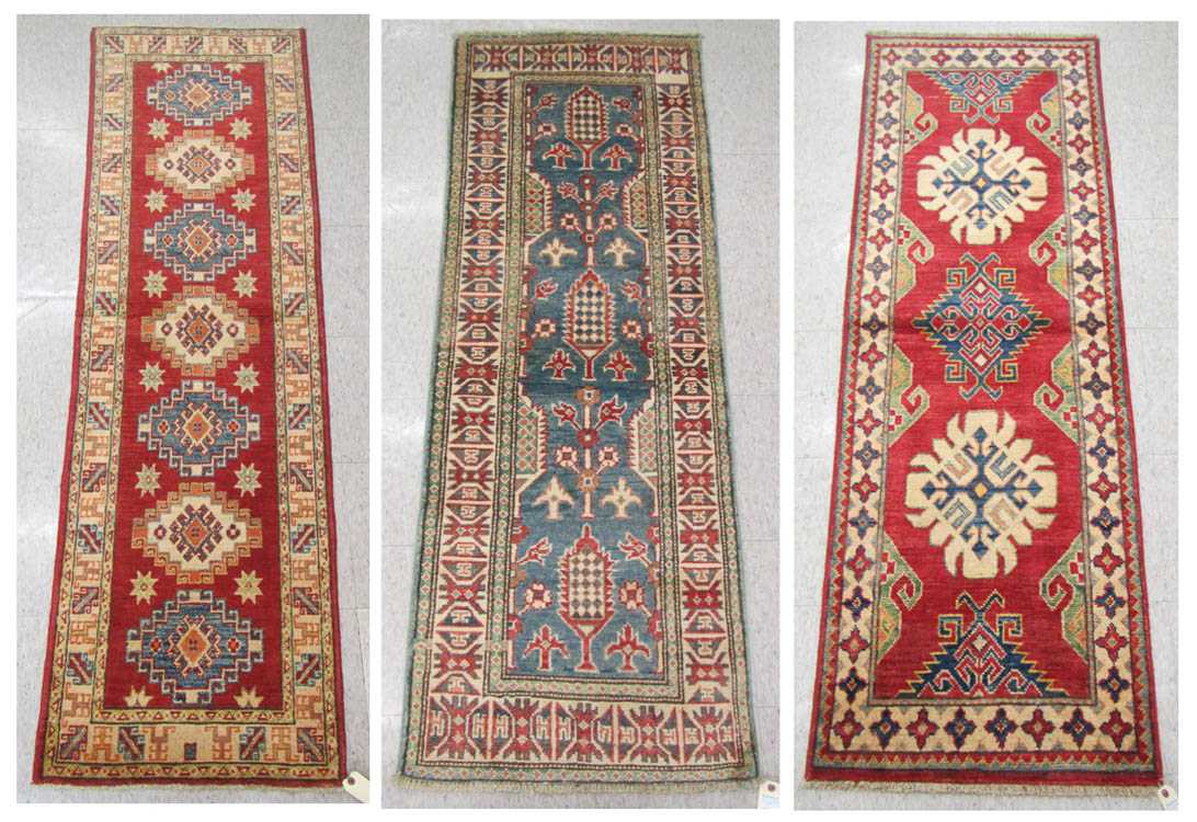 Appraisal: THREE HAND KNOTTED ORIENTAL AREA RUGS Pakistani Caucasian one blue