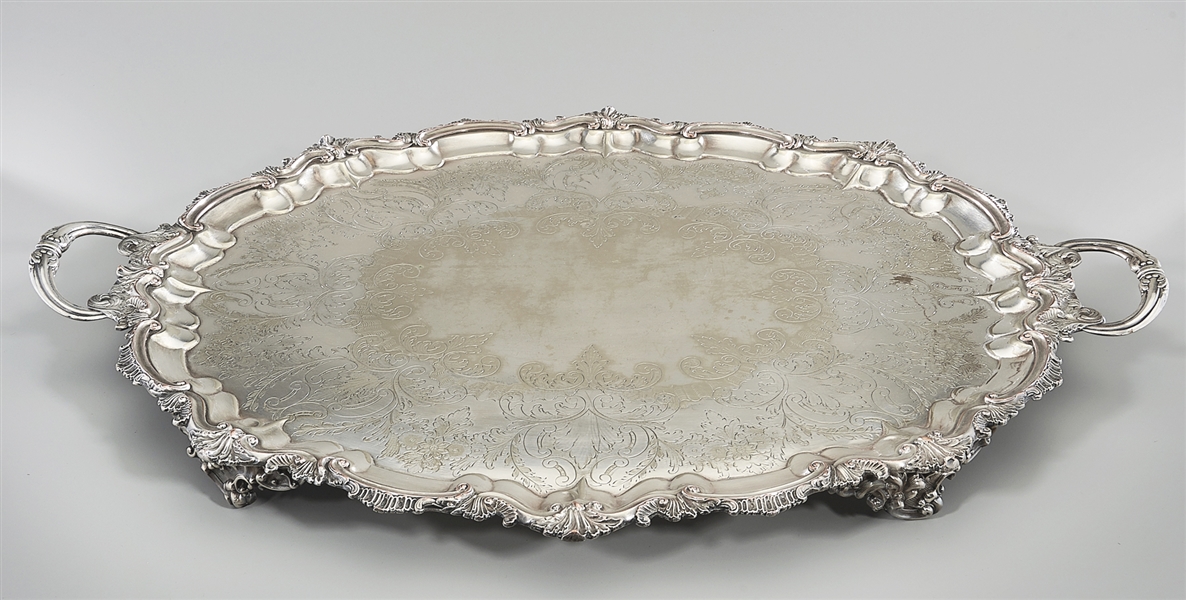 Appraisal: Two large elaborate silver plate footed trays with intricate scrolling