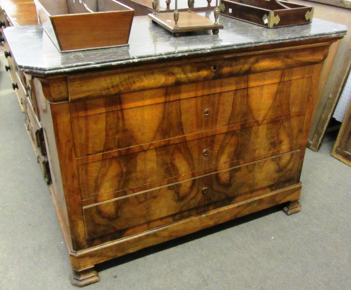 Appraisal: A French walnut Louis Phillipe commode the canted marble top