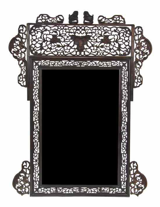 Appraisal: A Chinese Carved Wood Mirror having pierce carved decoration throughout