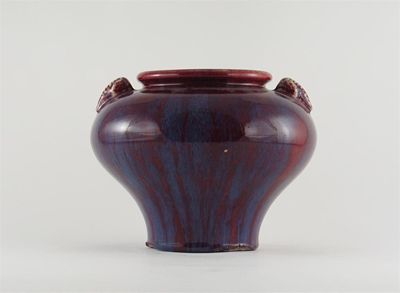 Appraisal: A Chinese red flamb glazed inverted pear-shaped vase with elephant