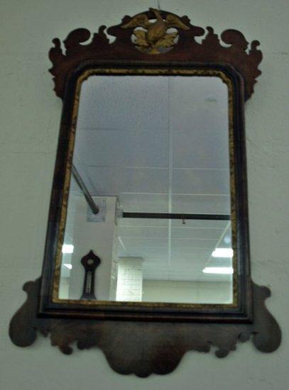 Appraisal: A late th Century mahogany wall mirror with gilded griffin