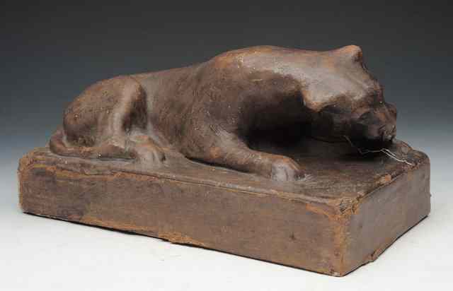 Appraisal: A LEATHER COVERED SCULPTURE of a resting tiger signed H