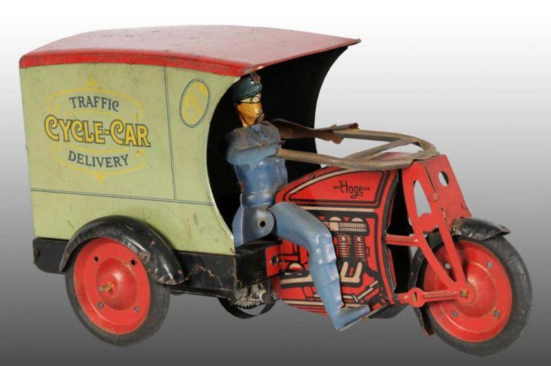 Appraisal: Tin Hoge Motorcycle Delivery Wind-Up Toy Description Working Original driver