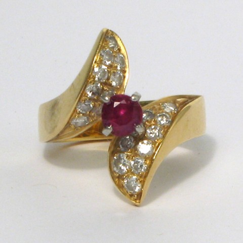 Appraisal: RUBY DIAMOND AND EIGHTEEN KARAT GOLD RING centering a round-cut