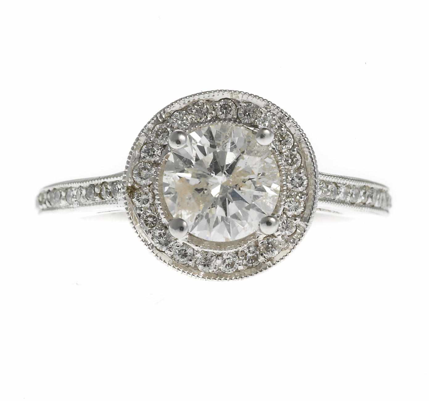 Appraisal: A diamond ring central round brilliant-cut diamond weighing approximately carat