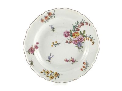 Appraisal: A Chelsea plate with shaped rim painted with a floral