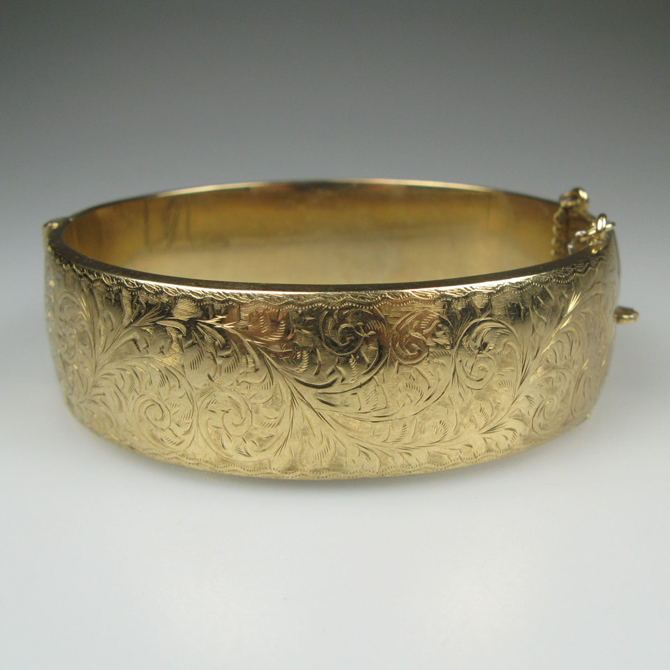 Appraisal: Birks English k Yellow Gold Hinged Bangle with engraved decoration