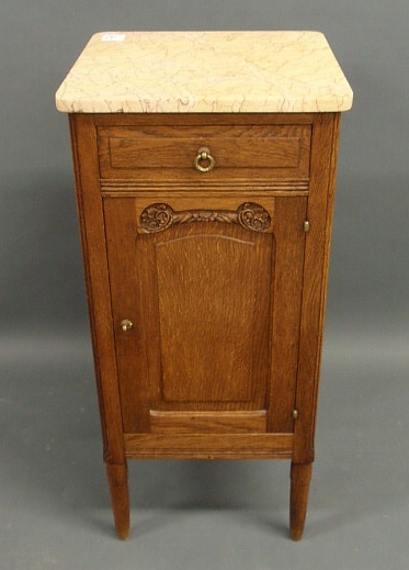 Appraisal: Oak cabinet with a marble top c h top x