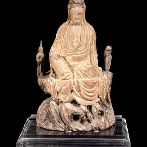 Appraisal: A Chinese Polychrome Painted Wood Carving of Guanyin depicted seated