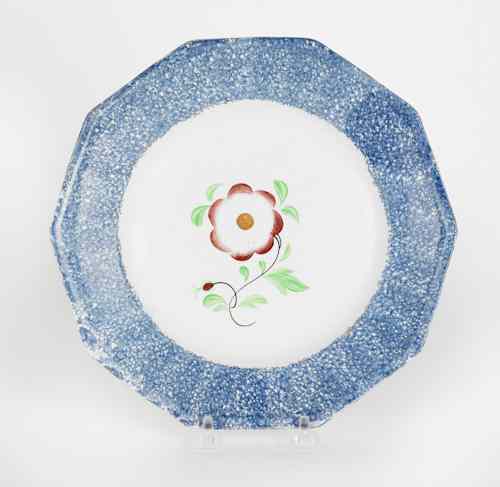 Appraisal: Blue spatter plate with a primrose th c dia Provenance