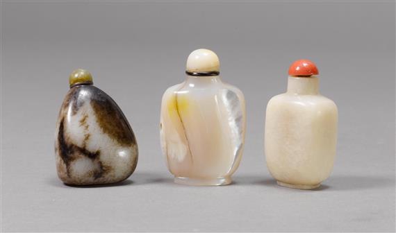 Appraisal: THREE SNUFF BOTTLES ONE JADE PEBBLE ONE JADE-LIKE STONE AND