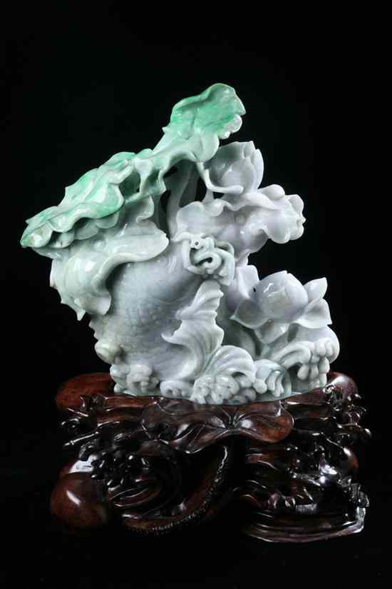 Appraisal: CHINESE LAVENDER AND APPLE GREEN JADEITE FIGURE OF FISH Carved