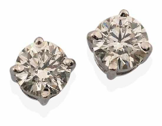 Appraisal: A PAIR OF DIAMOND STUD EARRINGS Each round brilliant cut