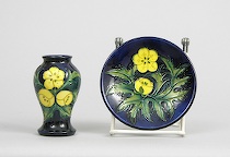 Appraisal: Small Moorcroft Vase and Plate Small Moorcroft vase and plate