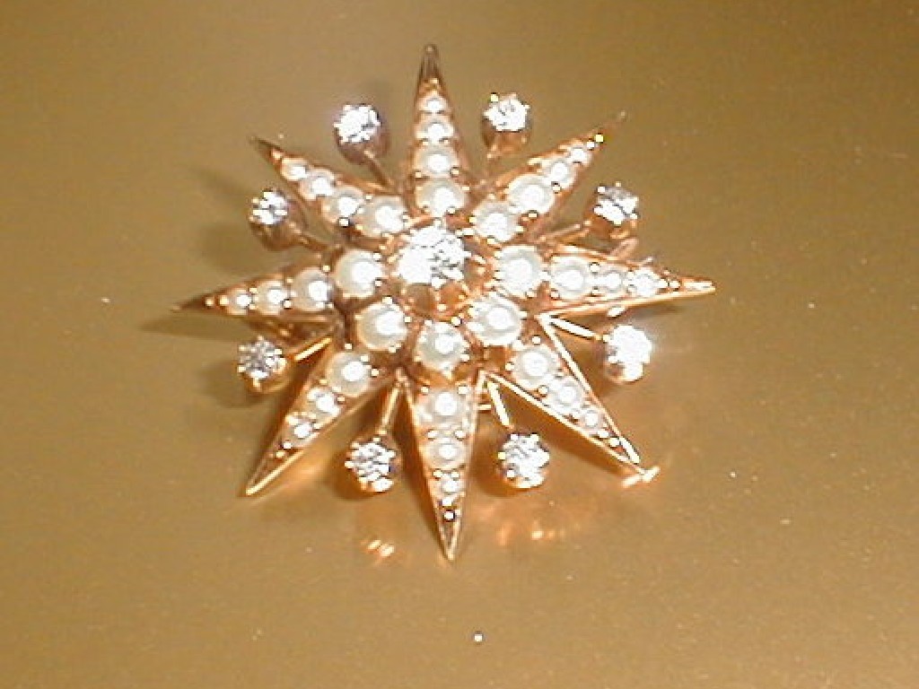 Appraisal: A Victorian diamond and seed pearl set star brooch in