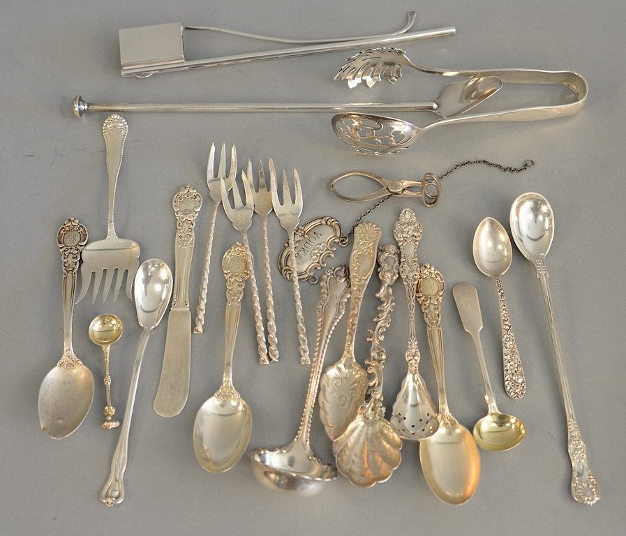 Appraisal: Group of sterling silver spoons tongs and serving pieces one