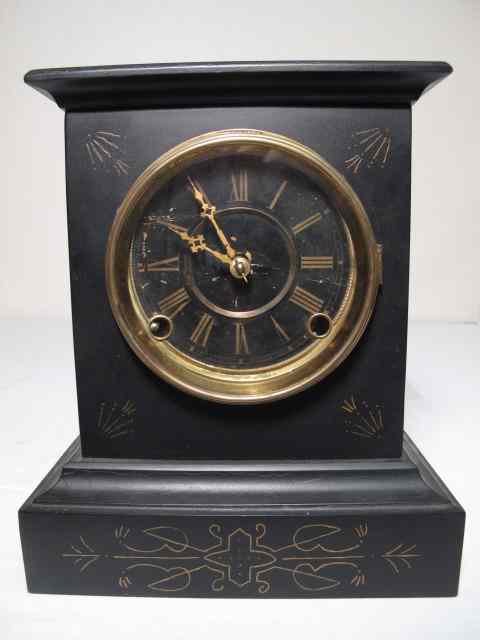 Appraisal: A French black marble mantle clock with engraving and gold