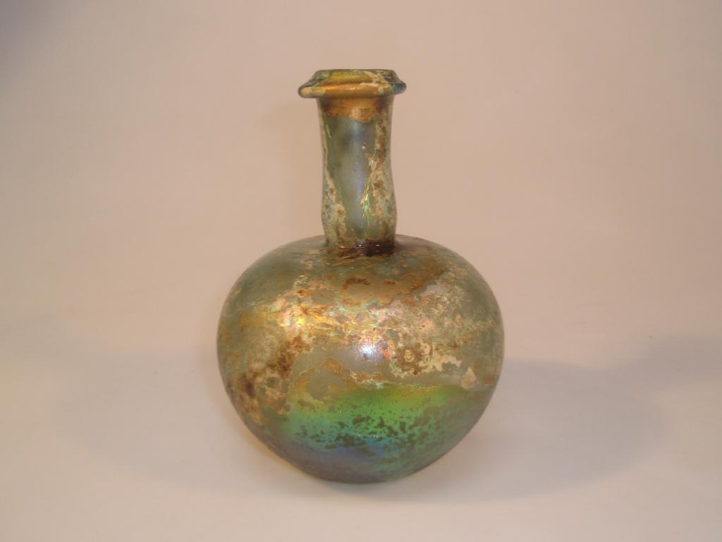 Appraisal: A large Roman bluish-green bulbous glass bottle with an infolded