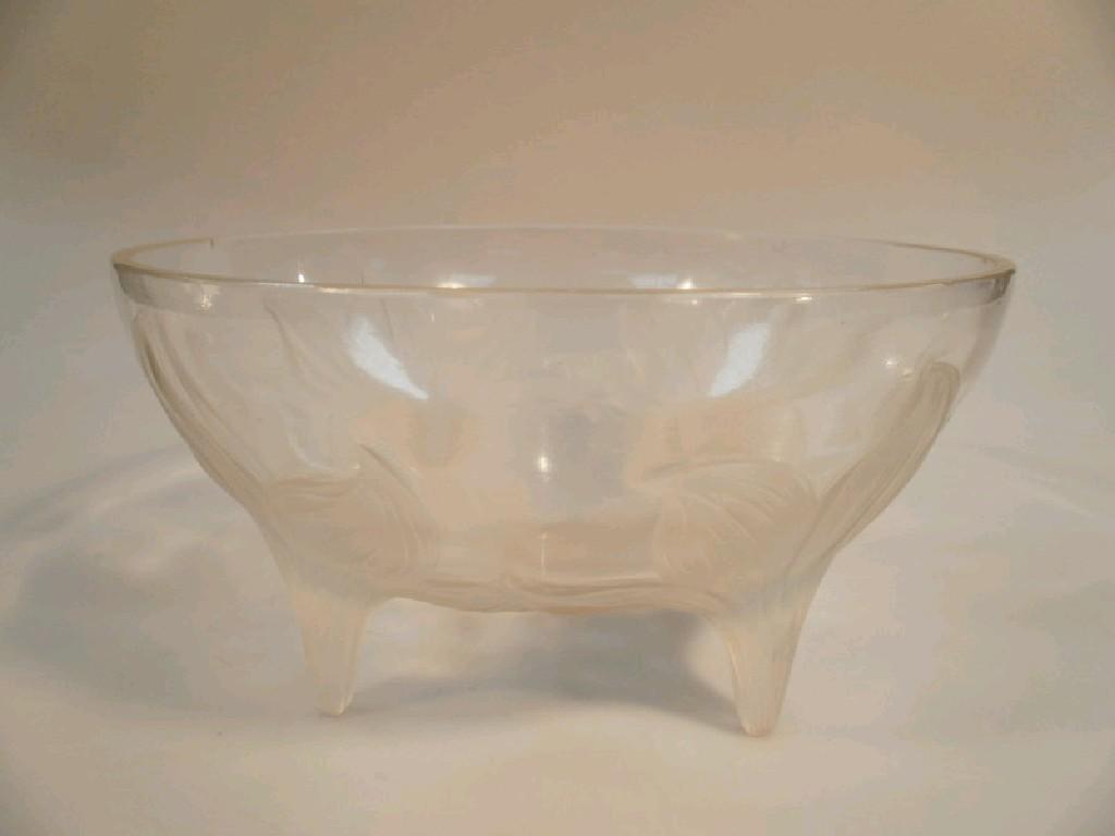 Appraisal: A Lalique circular bowl supported on four frosted lily flower